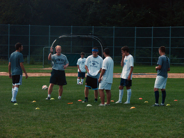 UNH coach Ewan Seabrook running skills camp for St. Thomas soccer